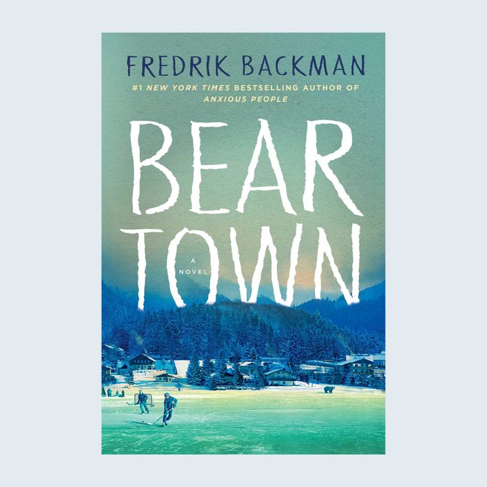 The book cover shows two people playing hockey on an icy field, with snowy houses and forests under a sky. Text: 