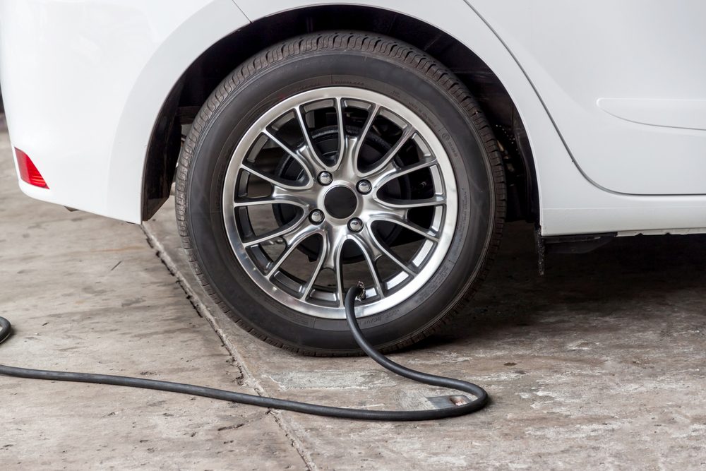 Filling air into a car tire 