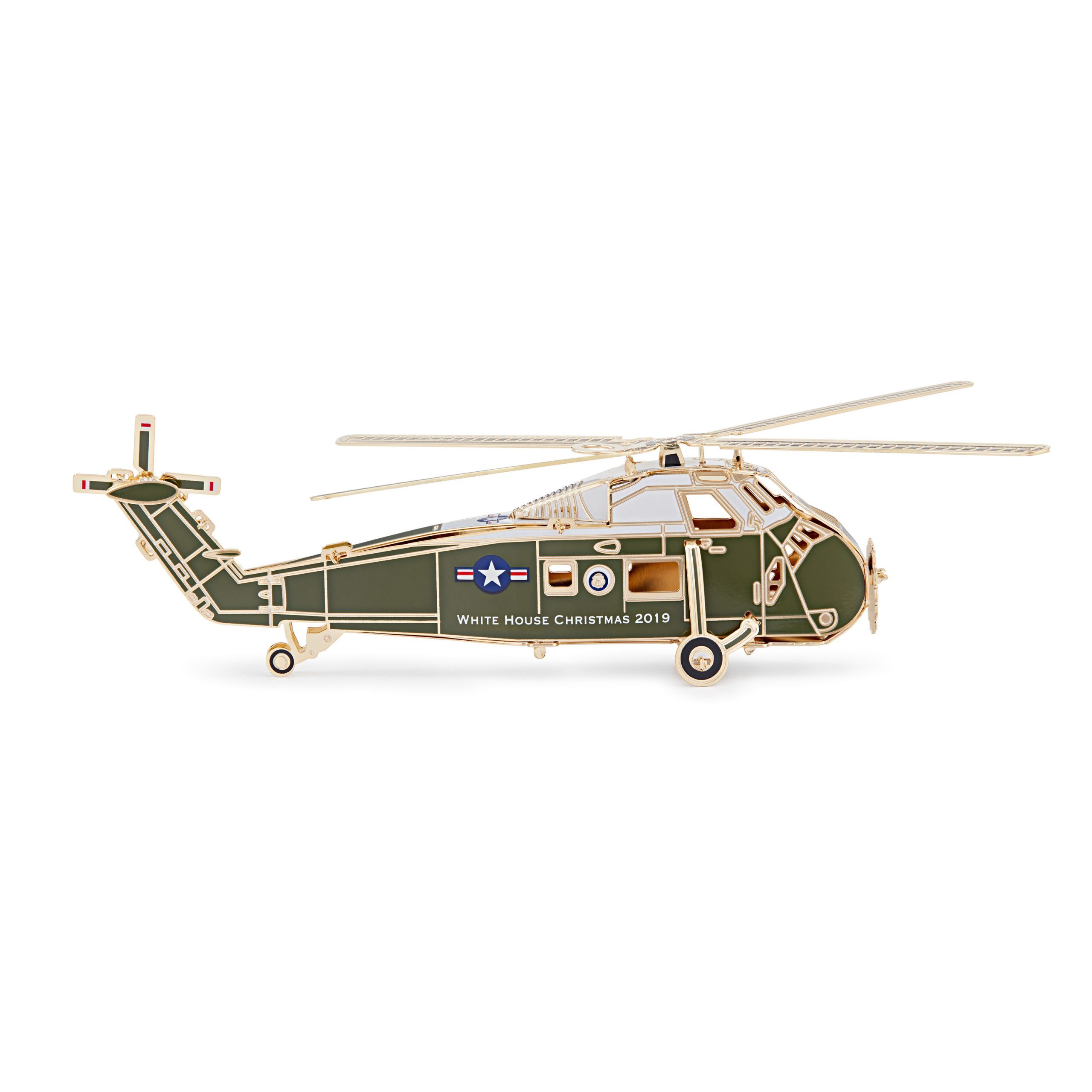 The White House Historical Association’s 2019 Official White House Christmas Ornament honors Dwight D. Eisenhower, 34th president of the United States. The design of the 2019 ornament follows President Eisenhower’s example of fairness: as the first president to regularly use a helicopter, he had two Executive Flight Detachments for his transport provided by flight crews of the United States Army and the United States Marine Corps. To demonstrate his impartiality, Eisenhower alternated between these helicopters and their respective military personnel. Likewise the 2019 ornament does not represent a single branch of the military. One side features the Presidential Seal, representing Eisenhower’s two terms as commander in chief of the Armed Forces. On the other is his five-star rank, honoring his military service as a general in the United States Army. The 39th Official White House Christmas Ornament is American-made by a veteran-owned company and continues the tradition of honoring U.S. presidents in sequential order. The sale of every ornament supports the Association’s mission to preserve, protect, and provide public access to the White House and educate the public on its history.