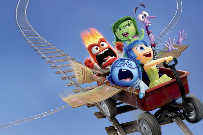 Colorful characters express emotions while riding a thrilling rollercoaster in a red cart against a clear blue sky backdrop.
