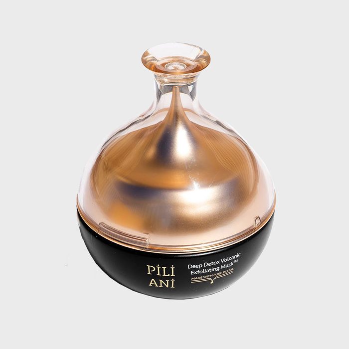 Jar containing a golden liquid, labeled 